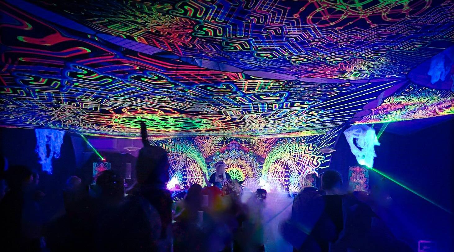 A colorful and slightly psychedelic photo taken in HUG Halloween 2024 Psykoosi stage.